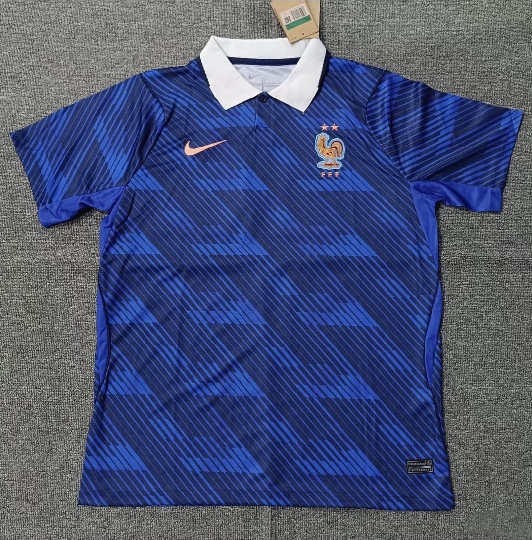 France home jersey in blue with Nike branding, white collar, and FFF crest with two stars
