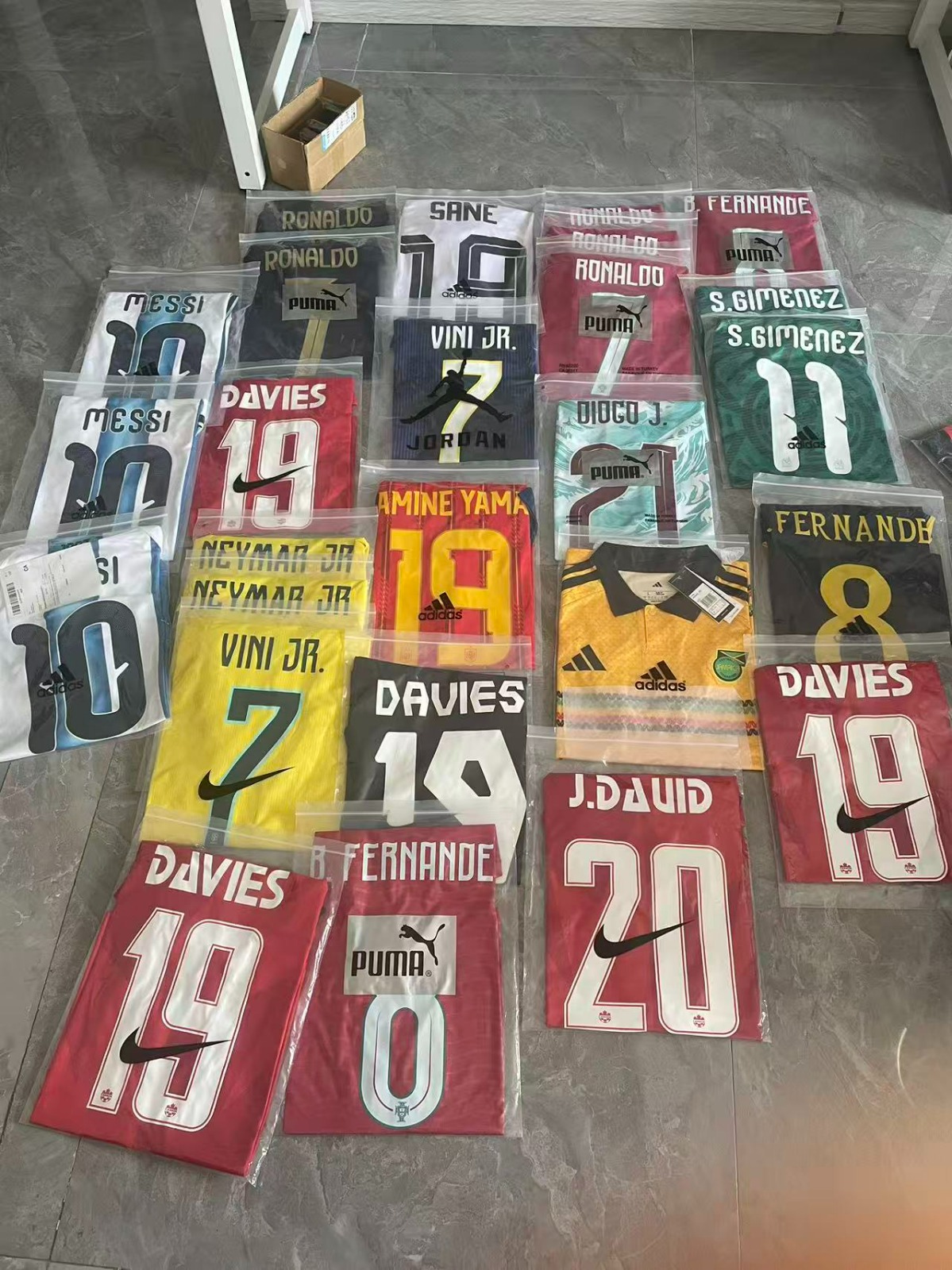 Wide selection of World Cup jerseys featuring Davies, Neymar Jr, Vini Jr, Fernandes, and more