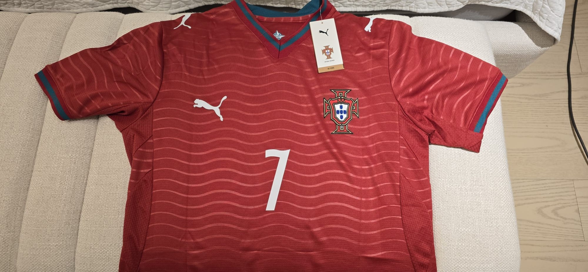 Portugal home jersey in red with Puma branding, number 7, and Portuguese crest